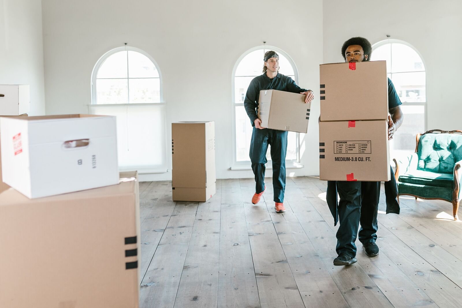 Movers carrying boxes into a home during a residential move in Dayton, Ohio